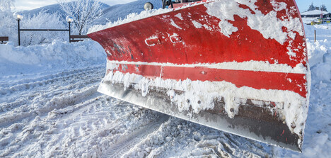 Picture of a snowplow blade clearing a roadway